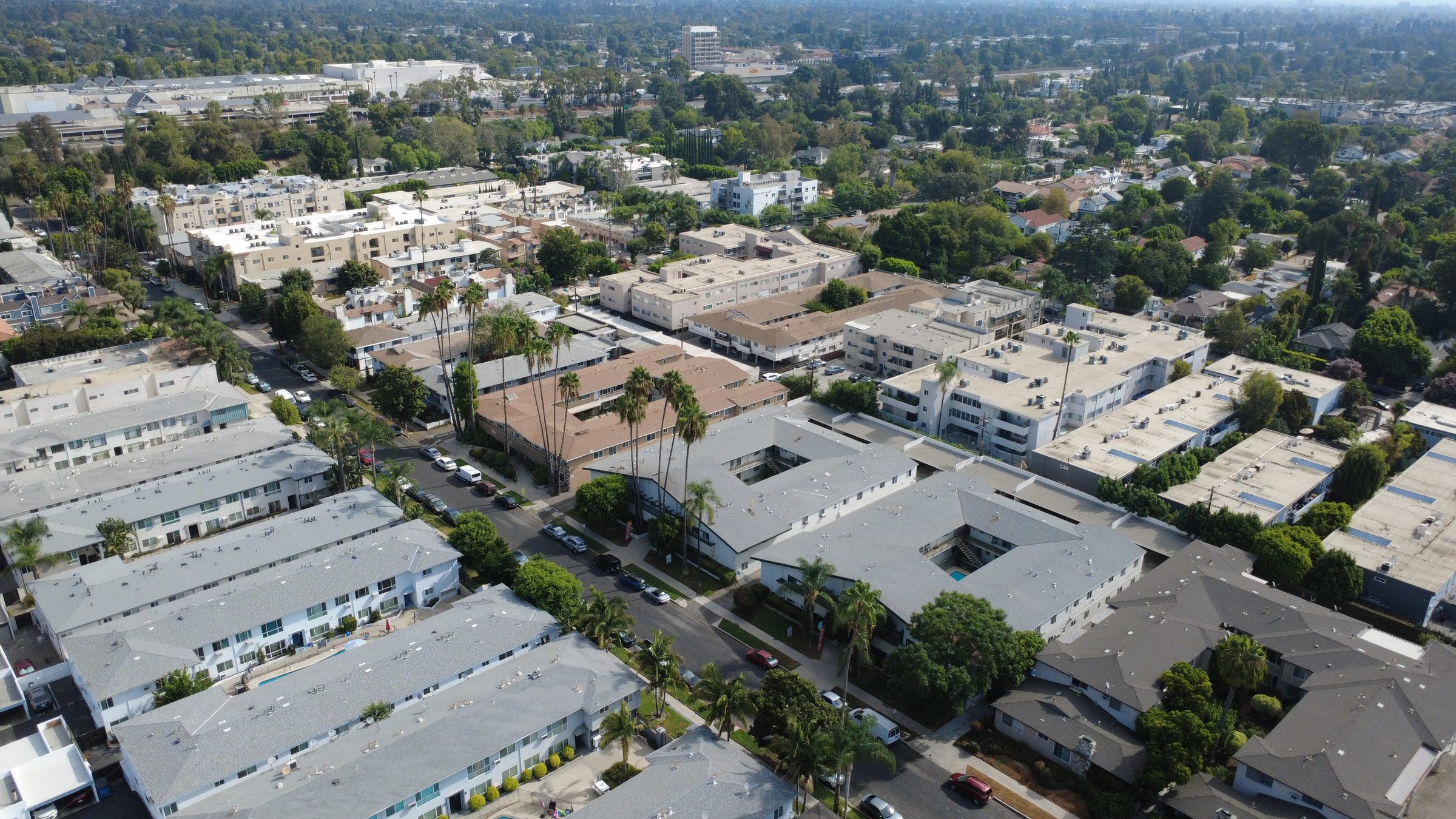 Aerial view of a dense multifamily apartment building neighborhood in the San Fernando Valley, the Los Angeles multifamily market Greg Shindler specializes in.